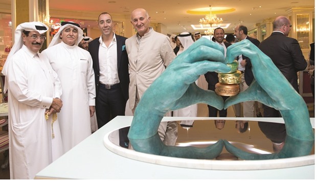 Dignitaries at Laduru00e9e Paris-Qatar after the opening of its newly renovated dining area and private room with the unveiling of a specially commissioned bronze sculpture.