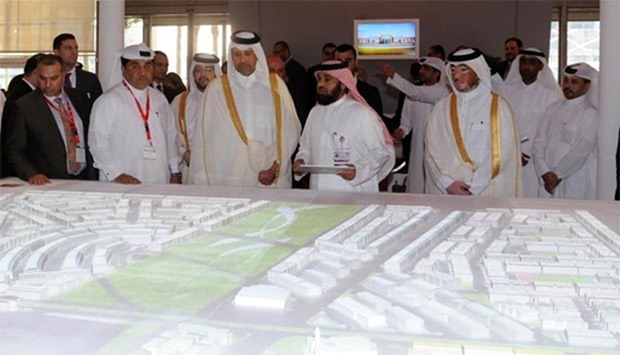 HE the Minister of Economy and Commerce Sheikh Ahmed bin Jassim bin Mohamed al-Thani viewing a digital model of Ezdan Oasis project at the Doha Exhibition and Convention Centre. PICTURE: Thajuddin