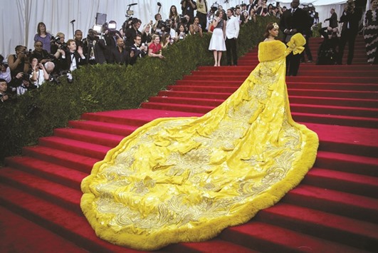 Singer Rihanna, wearing a dress by the Beijing-based designer Guo Pei, arrives at the Metropolitan Museum of Art Costume Institute Gala 2015 celebrating the opening of u2018China: Through the Looking Glassu2019 in Manhattan.