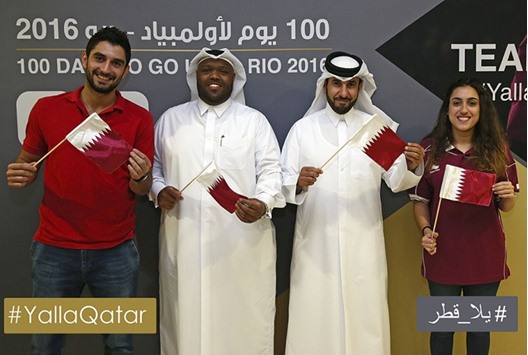 Qatar Olympic Committee Secretary General Dr Thani al-Kuwari (2nd right) with swimmers Nada Arkaji (right) and Noah al-Khulaifi (left) at the event to mark the 100 days countdown to Rio Games yesterday.
