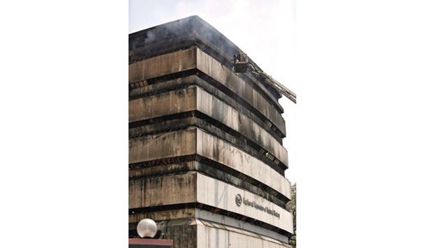 Firefighters work to extinguish a blaze in the building of National Museum of Natural History in New Delhi yesterday.