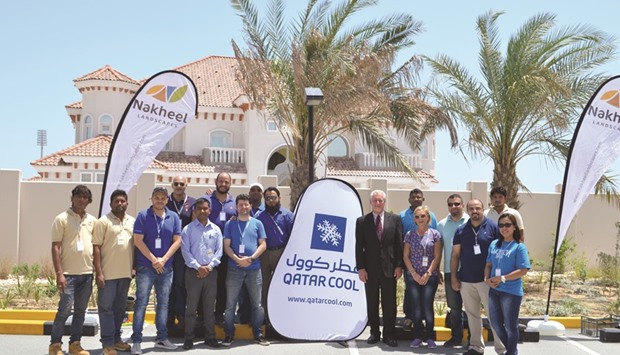 Qatar Cool and Nakheel Landscapes team members at an Earth Day event.