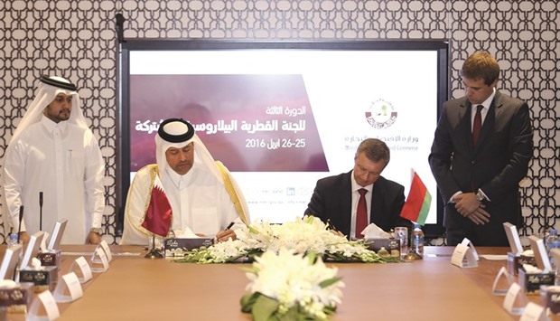 HE the Minister of Economy and Commerce Sheikh Ahmed bin Jassim bin Mohamed al-Thani and Belarus Minister of Trade Vladimir Koltovich signing an agreement in Doha.