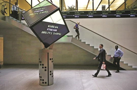 People walk through the lobby of the London Stock Exchange. The LSE stuck to its guns yesterday over its planned merger with Deutsche Boerse, saying the deal would be derailed by neither regulators nor any British exit from the European Union.