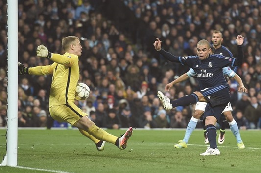 Manchester Cityu2019s goalkeeper Joe Hart (left) makes a save off Real Madrid defender Pepe during the Champions League semi-final first leg in Manchester. (AFP)