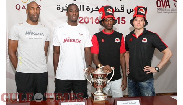 El Jaish players Robertlandy Simon and Oreol Camejo, and Al Rayyanu2019s Osman Ajab and Zbigniev Bartman pose with the Qatar Cup trophy at a press conference yesterday. PICTURES: Nasar TK