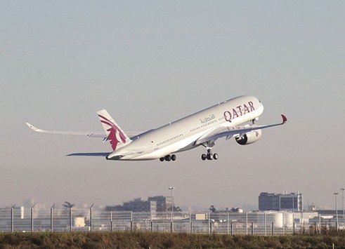 A Qatar Airways A350 takes off from the Airbus headquarters in Toulouse in this file photo dated December 22, 2014. Qatar Airways lifted its stake in IAG close to 12%, strengthening ties built around the access BA provides to North America via London and the Gulf carrieru2019s network of Asian routes.