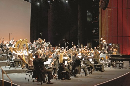 THE PERFORMANCE: Giovanni Pasini conducts the final note of Pyotr Ilyich Tchaikovskyu2019s Capriccio Italien, a combined orchestra of Qatar Music Academy students and Qatar Philharmonic Orchestra professional musicians, performance of Friday, in Qatar National Convention Centre Theatre.