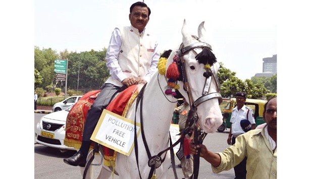 BJP MP Ram Prasad Sharma arrives in parliament riding a horse yesterday.