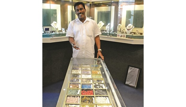 Jewellery dealer Nisha Abeygunawardena posing in one of his stores in Bentota, some 65km south of Colombo.