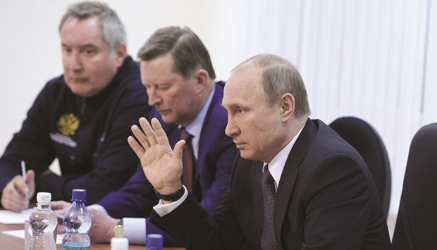 Putin, the presidentu2019s chief of staff Sergei Ivanov and Deputy Prime Minister Rogozin (left) attend a meeting with space officials after the inaugural launch of a Soyuz rocket was called off because of a technical fault at the Vostochny cosmodrome, in the far eastern Amur region of Russia.