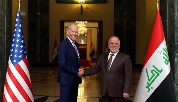 Iraqi Prime Minister Haider al-Abadi shakes hands with US Vice President Joe Biden in Baghdad on Thursday.