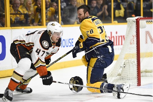 Anaheim Ducks' Hampus Lindholm (left) and Nashville Predators' Paul Gaustad (right) battle near the net during the NHL game in Nashville. (USA TODAY Sports)