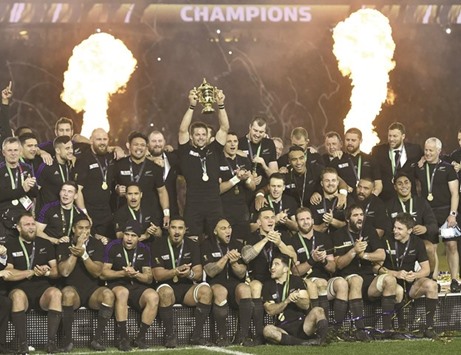 In this November 6, 2015, picture, Richie McCaw holds the Webb Ellis Cup during a parade in Wellington after New Zealand won the Rugby World Cup in England. New Zealand Rugby recorded a loss despite winning their second consecutive World Cup. (AFP)