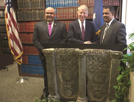 Manhattan District Attorney Cyrus R. Vance, Jr. (centre), Deputy Chief of Mission for the Embassy of Pakistan to the US, Rizwan Saeed Sheikh (right), and Special Agent in Charge of Homeland Security Investigations New York, Angel M Melendez announce the return of a 2nd century CE Buddhapada sculpture to Pakistan during a repatriation ceremony on Wednesday in New York.
