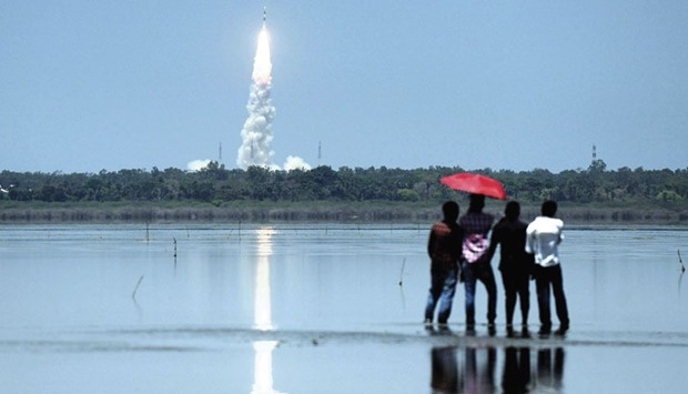 Bystanders look on as ISROu2019s navigation satellite IRNSS-1G, on board the Polar Satellite Launch Vehicle is launched from Sriharikota yesterday.