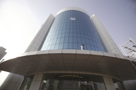 A worker cleans glass of the Securities & Exchange Board of India building in Mumbai. Indiau2019s markets regulator is coming under increased pressure to improve its  oversight of high-speed trading after allegations of unfair access at the nationu2019s biggest equity bourse.