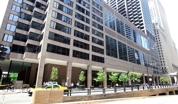 The front facade of the CME Group headquarters is seen in Chicago. Currency trading via CME, ICAP and Thomson Reuters Corp - three of the largest trading platforms - fell to $538bn per day last month, from more than $669bn in September 2014, according to data compiled by Bloomberg.
