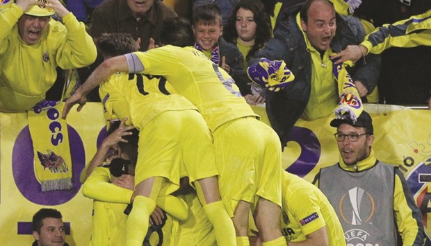 Villarreal's Adrian celebrates with teammates after scoring against Liverpool on Thursday.