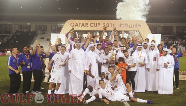 El Jaish players celebrate with the Qatar Cup trophy yesterday at the Al Sadd stadium. Jaish defeated Lekhwiya 2-1 to win the 2016 edition. PICTURESS: Noushad Thekkayil & Shemeer Rasheed
