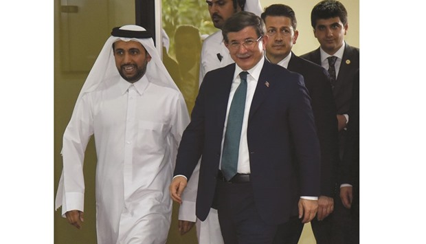 Turkish Prime Minister Ahmet Davutoglu was welcomed by QU president Dr Hassan Rashid al-Derham. PICTURE: Noushad Thekkayil