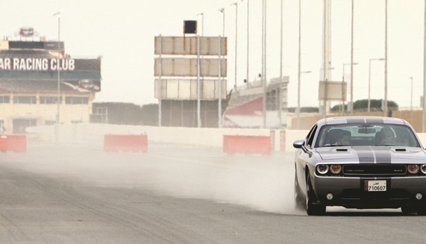 A test driver experiences the power of the Dodge Challenger SRT. PICTURE: Nasar TK