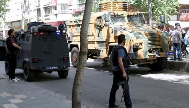 A Turkish military vehicle is surrounded by security forces after an accident in the Kurdish-dominated southeastern city of Diyarbakir this week.