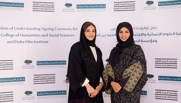Dr Amal al-Malki and Fatma al-Rumaihi after the signing ceremony.
