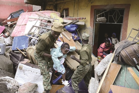 Kenyan rescuers evacuate a girl from the collapsed building in Nairobi.