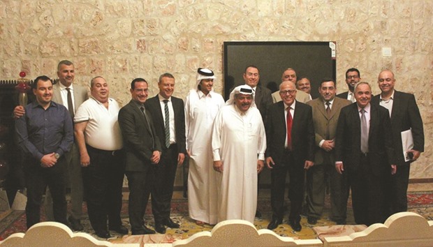 HE Sheikh Faisal bin Qassim al-Thani with other officials and staff at the event.