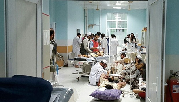 This undated handout photograph released by Medecins Sans Frontieres (MSF) on October 3, 2015, shows Afghan MSF medical personnel as they treat civilians injured following an air strike at the MSF hospital in Kunduz.