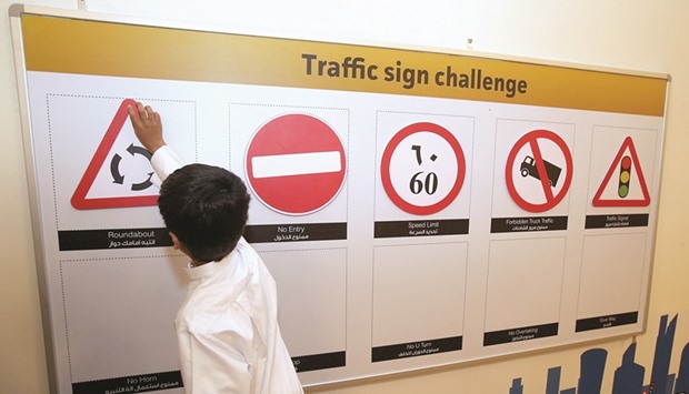 A student learns more about road signs as part of SFRS programme.