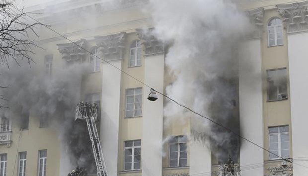 Firefighters work to extinguish a fire at the Russian Defence Ministry building in central Moscow on Sunday.