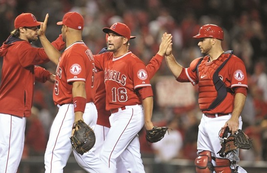 Los Angeles Angels relief pitcher Huston Street (No 16) celebrates the 3-2 victory against the Texas Rangers at Angel Stadium of Anaheim on April 24, 2015. PICTURE: USA TODAY Sports