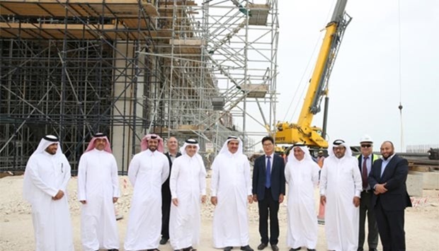 HE the Minister of Municipality and Environment Mohamed bin Abdullah al-Rumaihi and Ashghal officials at a construction site along the Orbital Highway route.