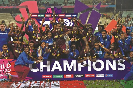 The West Indies menu2019s and womenu2019s teams pose with their World T20 trophies after clinching a historic double at the Eden Gardens in Kolkata yesterday. While the West Indies men beat England in the final, their women counterparts dethroned three-time defending champions Australia. It was the third ICC title for the West Indies this year after their Under-19 boys team had  won the World Cup  in Bangladesh beating India in the final in February.