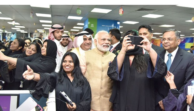 A woman employee takes a selfie with Modi during the prime ministeru2019s visit to an all-woman IT centre set up by Tata Consultancy Services (TCS) in Riyadh yesterday.