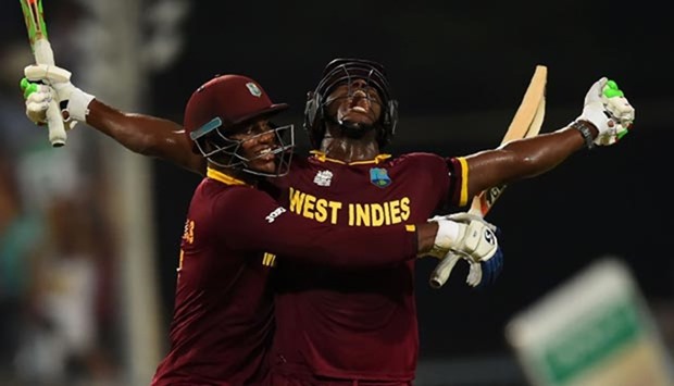 Carlos Brathwaite (right) and Marlon Samuels celebrate after West Indies beat England in the World T20 at the Eden Gardens in Kolkata.