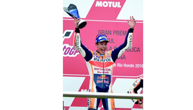 Spainu2019s biker Marc Marquez of Honda celebrates on the podium after winning the MotoGP race of the Argentina Grand Prix at the Termas de Rio Hondo circuit, in Santiago del Estero, Argentina. (AFP)