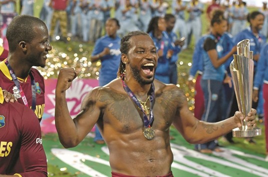West Indiesu2019Chris Gayle celebrates with the trophy after his team won the World T20 title at The Eden Gardens Cricket Stadium in Kolkata on Sunday.