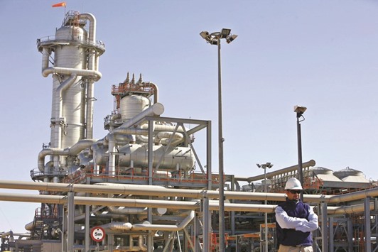 A technician stands at the Krechba gas treatment plant, about 1,200km south of Algiers in this December 14, 2008 file photo. Reliant on its mature fields, Algeriau2019s energy output has been stagnating for a decade.