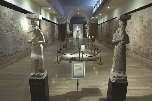 Assyrian artefacts originally from Mosul are displayed at Iraqu2019s National Museum in Baghdad yesterday.