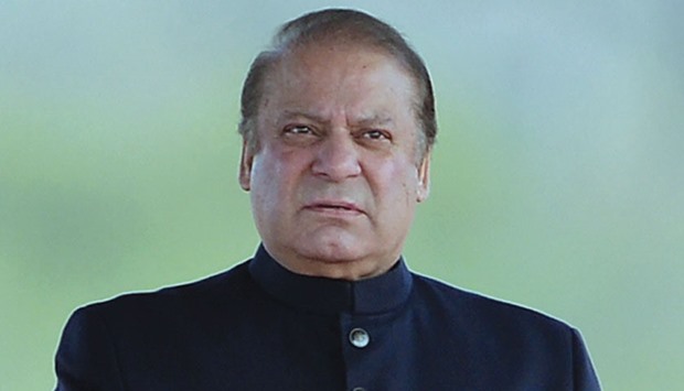 In this file photo Pakistanu2019s Prime Minister Nawaz Sharif looks on as he waits for the arrival of President Mamnoon Hussain at the venue of the Pakistan Day military parade in Islamabad.