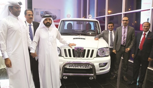 Ibin Ajayan Group CEO Ajayan Mehdi al-Ahbabi and Mahindrau2019s general manager (export international operations) Dinesh Choudhari are seen with other officials during the launch of the Scorpio `Pik Upu2019 vehicle yesterday. PICTURE: Jayan Orma