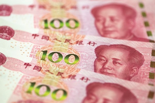 The Chinese currency will weaken 3.3% versus the dollar by year-end, according to a Bloomberg survey of strategists