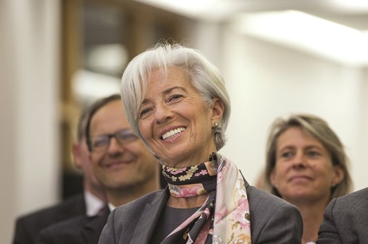 IMF managing director Christine Lagarde reacts before delivering a speech at Goethe university in Frankfurt yesterday. The world outlook is clouded by u201cweak growth, no new jobs, no high inflation, still high debt u2014 all those things that should be low and that are high,u201d Lagarde said in an interview yesterday.