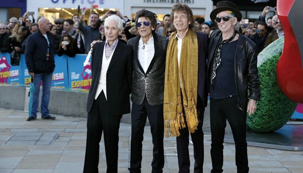 Members of the Rolling Stones (left to right) Charlie Watts, Ronnie Wood, Mick Jagger and Keith Richards arrive for the u201cExhibitionismu201d opening at the Saatchi Gallery in London.