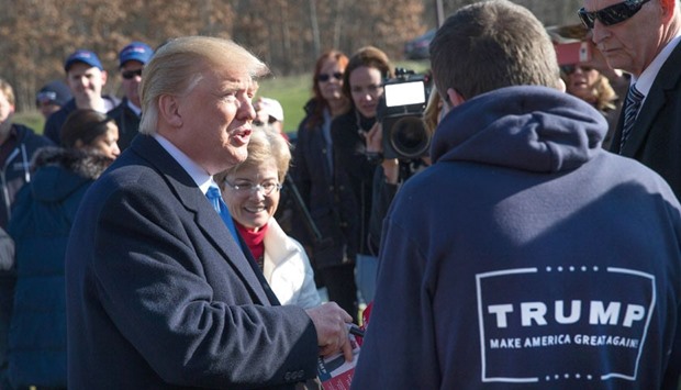 Republican presidential contender Donald Trump speaks yesterday to voters and supporters outside a polling place at the Waukesha Fire Department in Waukesha, Wisconsin.