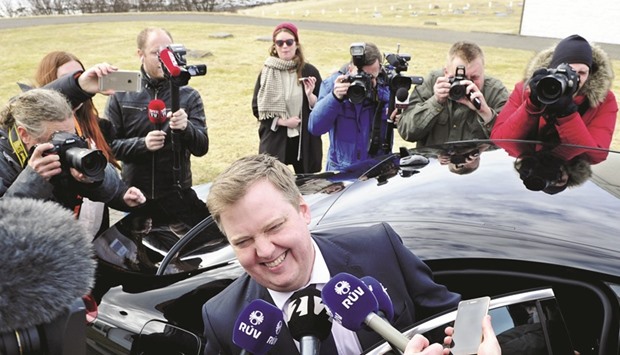 Gunnlaugsson laughs while speaking to the media outside the Iceland presidentu2019s residence in Reykjavik.