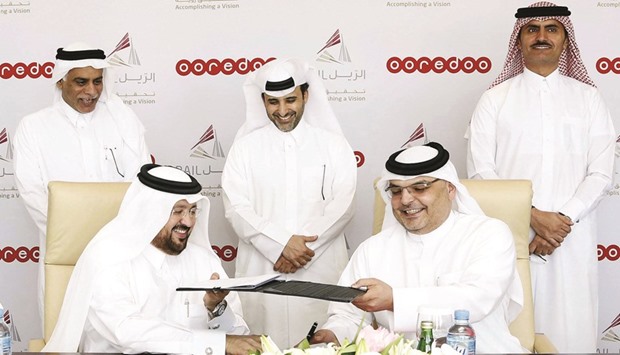 Ooredoou2019s al-Sayed and Qatar Railu2019s Dr al-Muhannadi at the MoU-signing ceremony.
